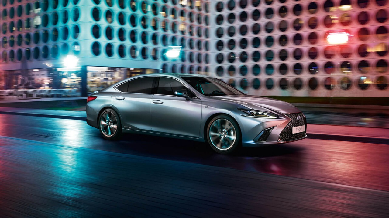 Lexus IS F Sport driving through a city location 