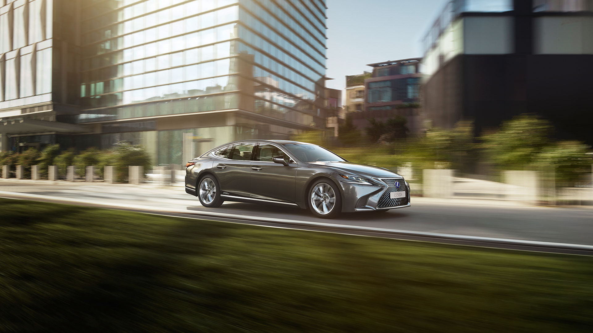 Lexus LS 500h driving in a city location 