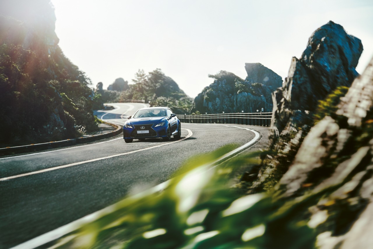 Lexus RC F driving in a rural location 