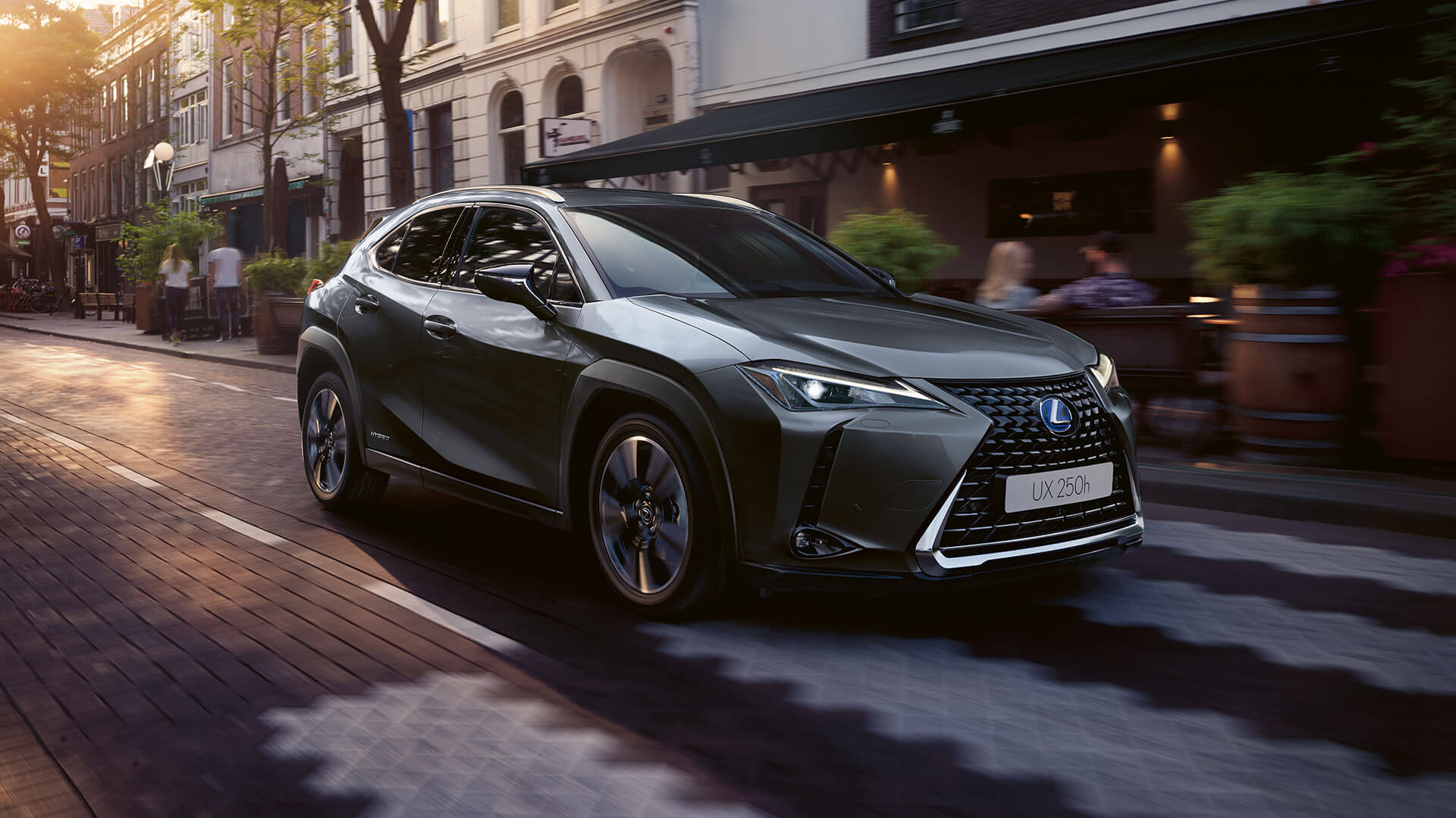 Lexus UX 250h driving in a town location 