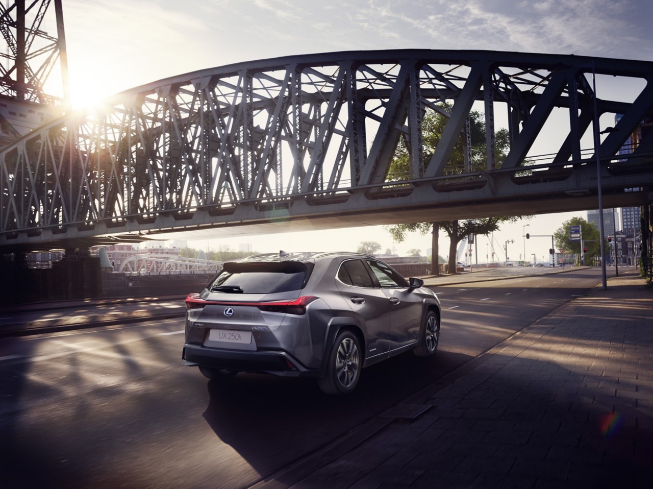 Lexus UX 250h driving in a town location 