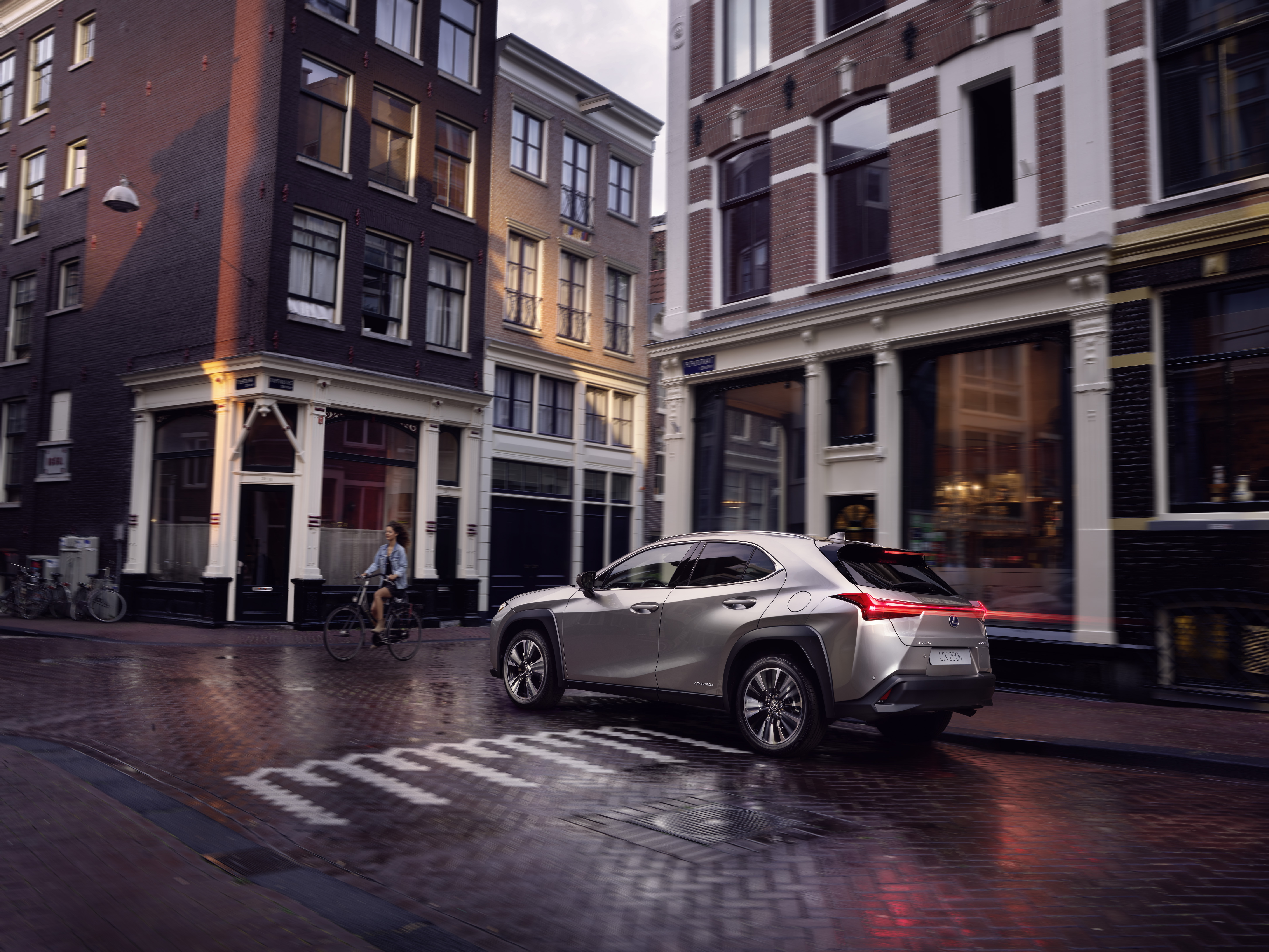 Lexus UX 250h driving in a town location 