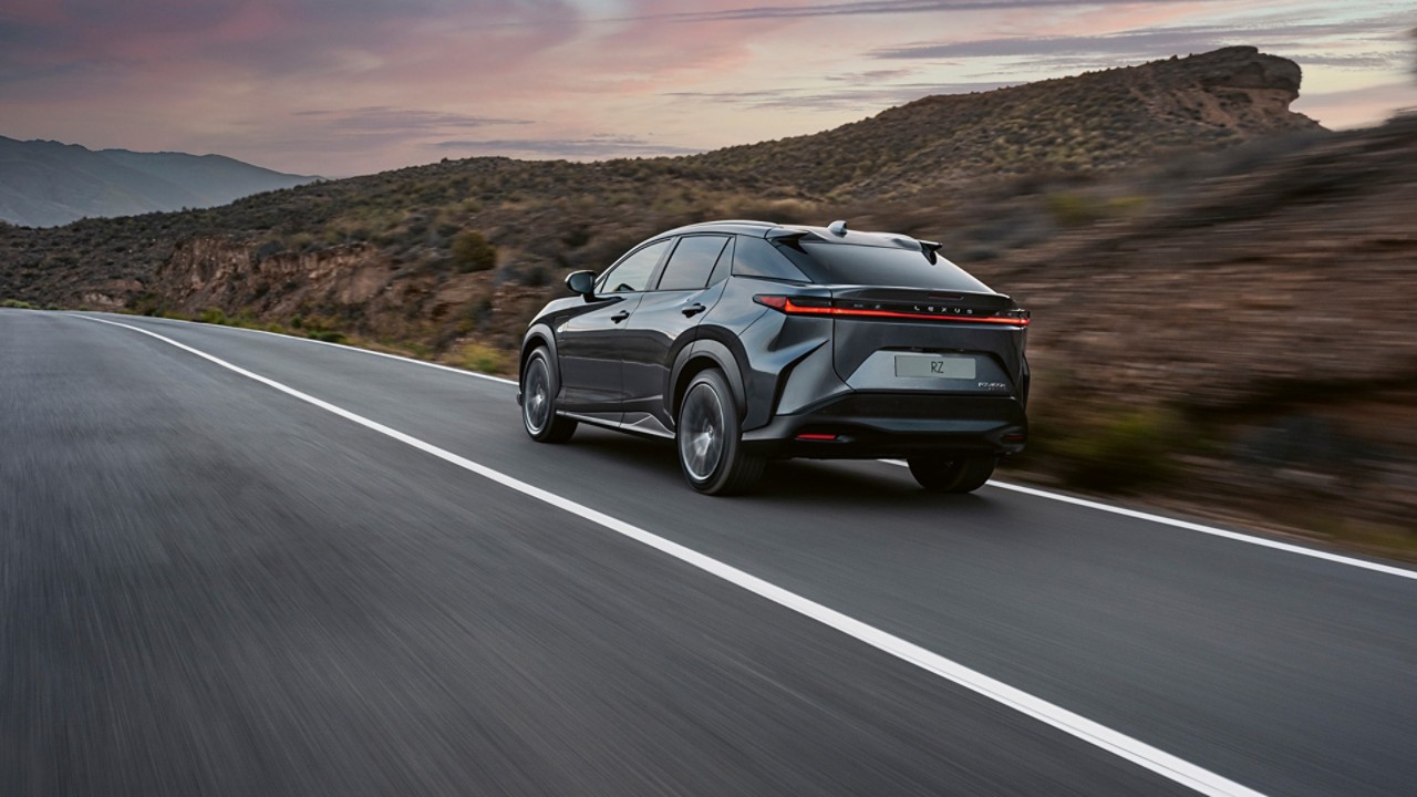 Lexus RZ driving in a rural location